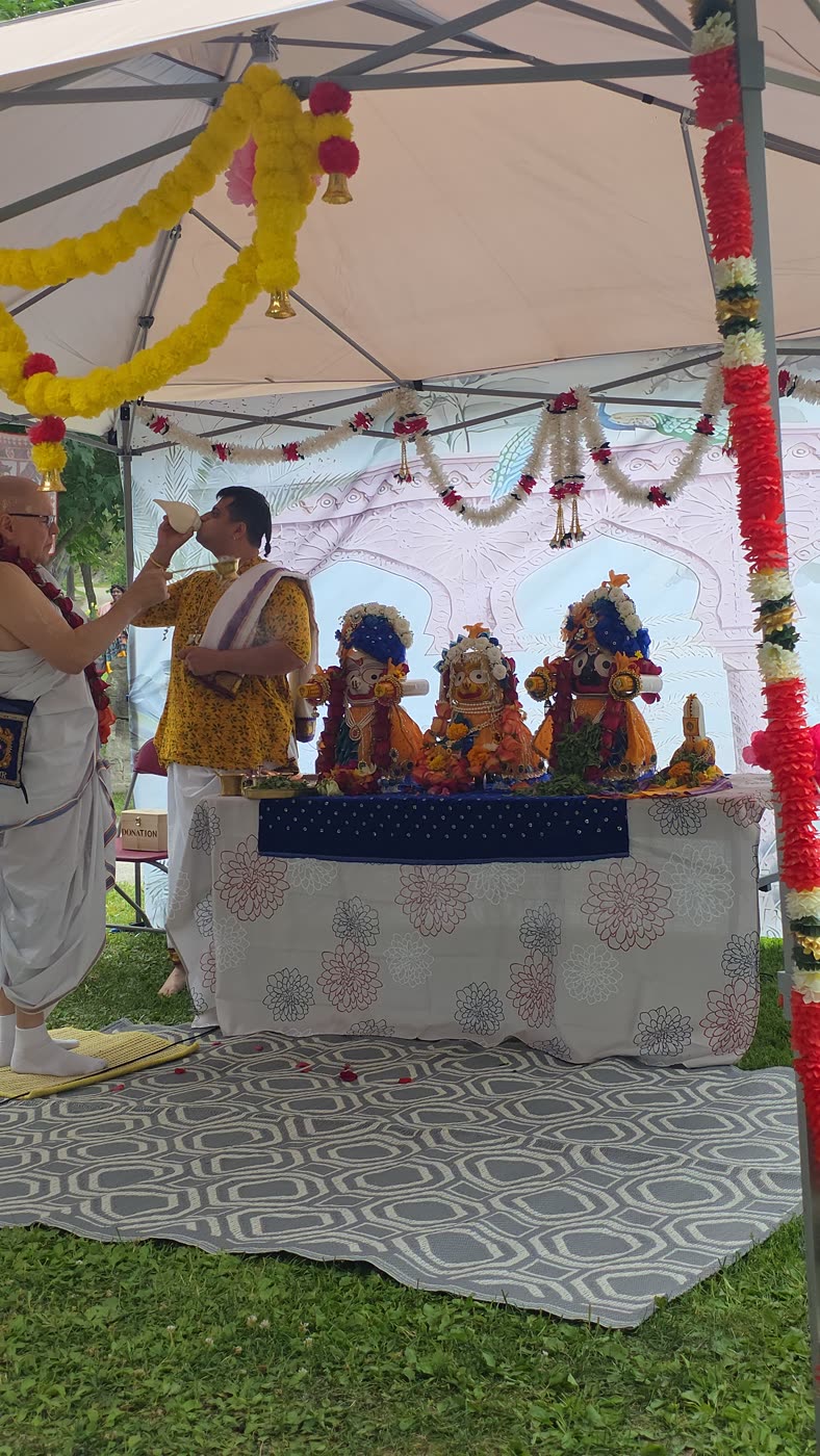 Ārati being offered at the marigold-decorated altar
