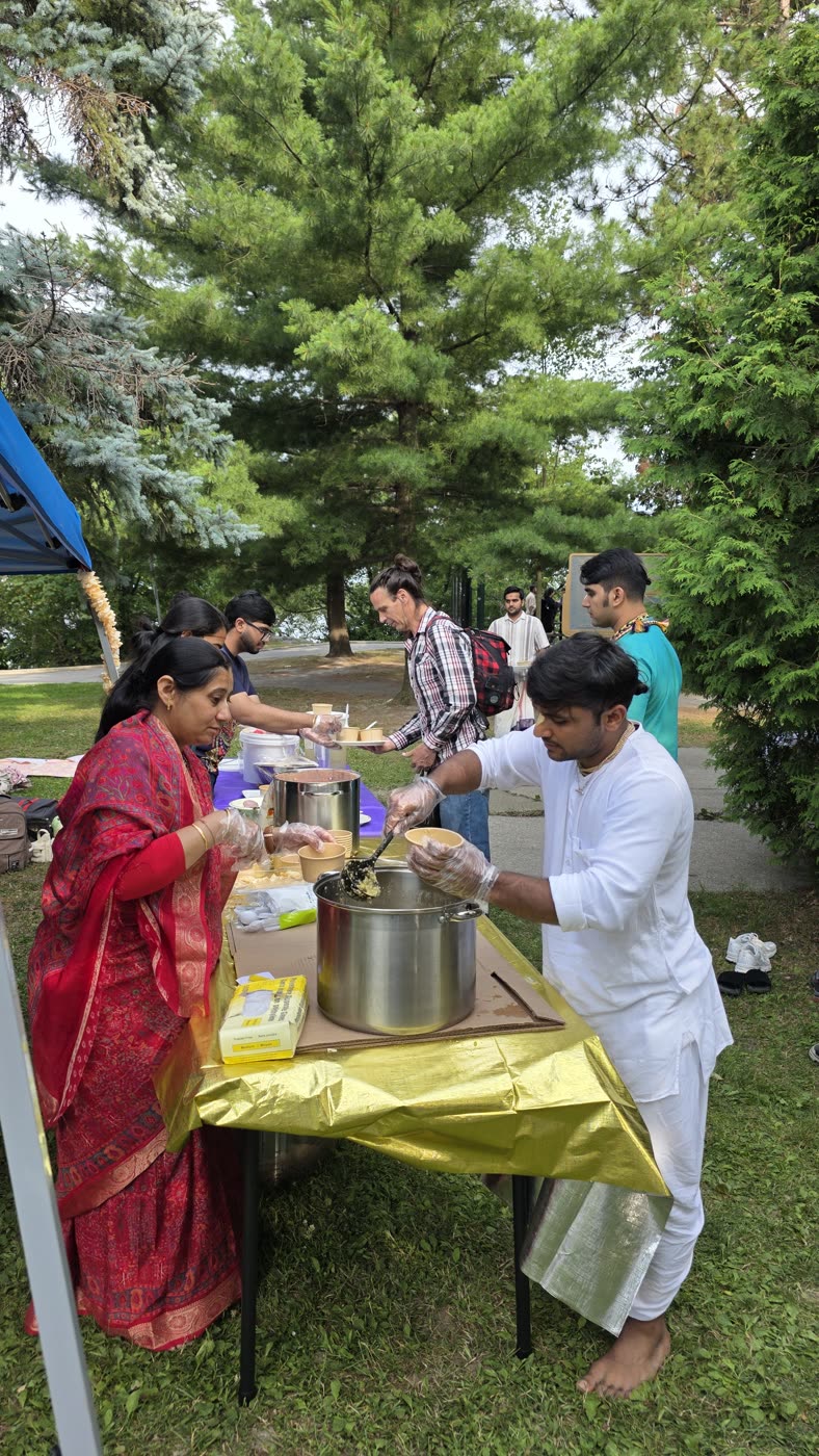 Prasādam being lovingly served at the festival