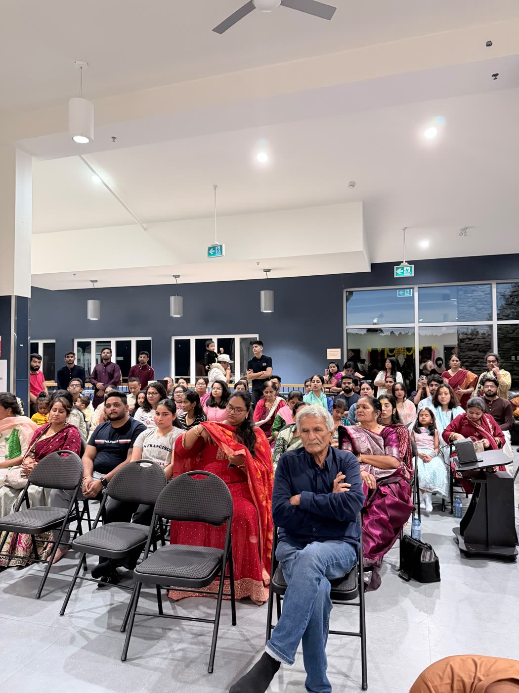 A full hall gathered for the evening Janmāṣṭamī program