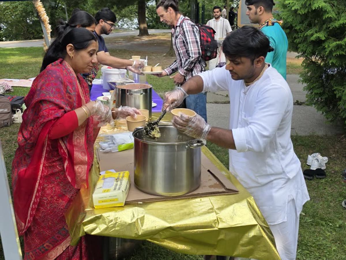 Wholesome vegetarian prasādam being lovingly served at a community gathering